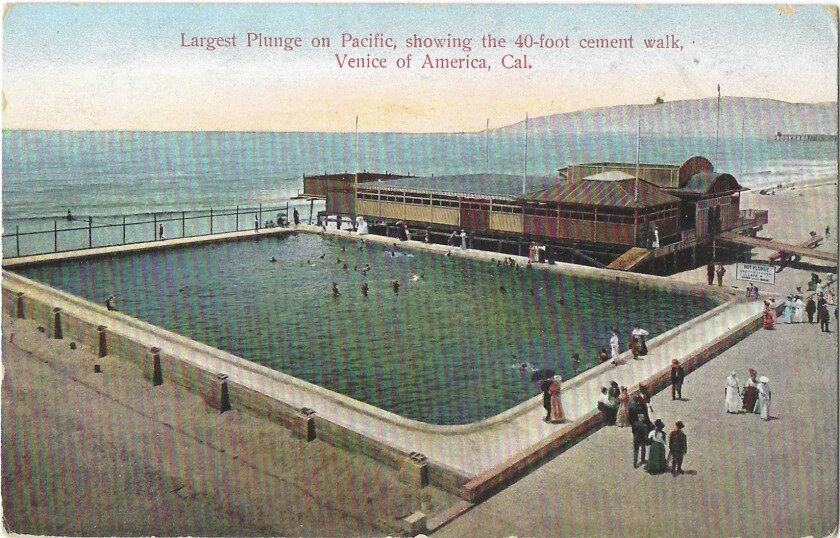 People swim in a large pool steps away from the Pacific. 