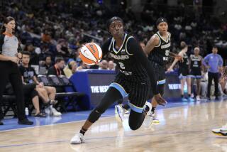 Chicago Sky's Kahleah Copper drives to the basket during a WNBA basketball game.