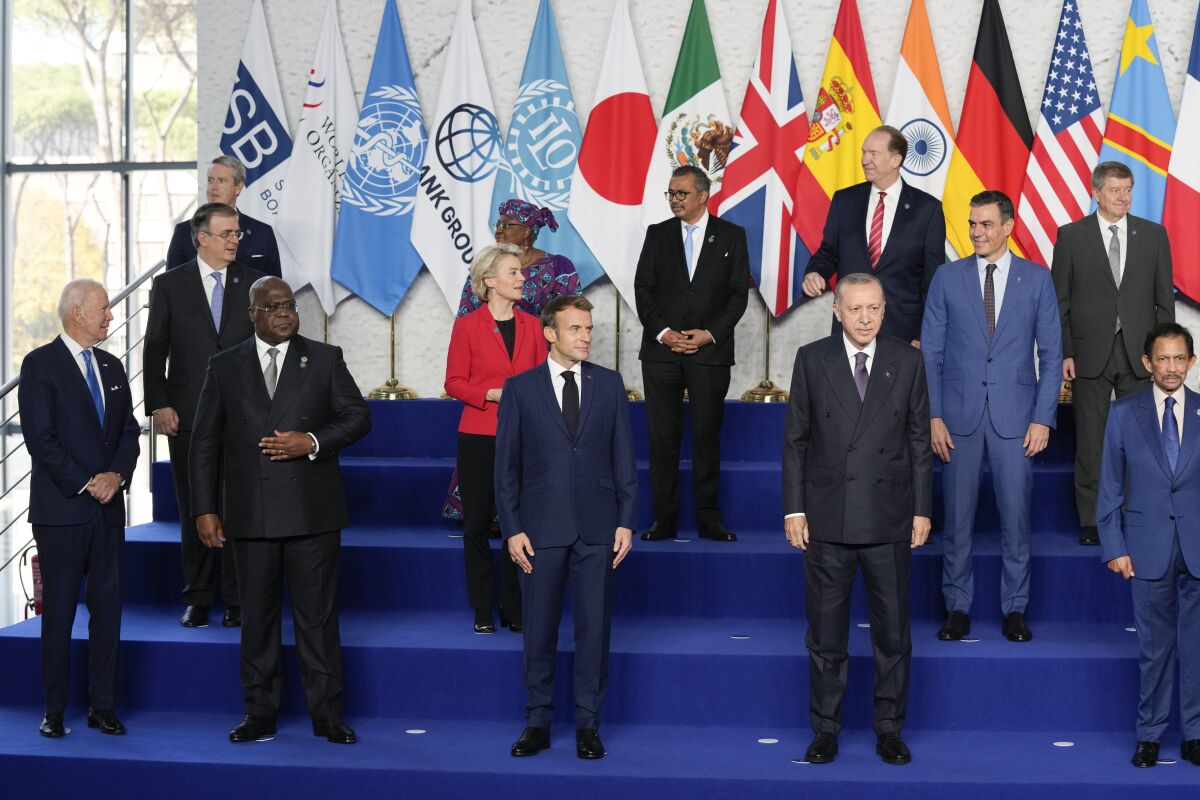 President Biden joins other world leaders for the traditional "family photo" on the first day of the G-20 summit.