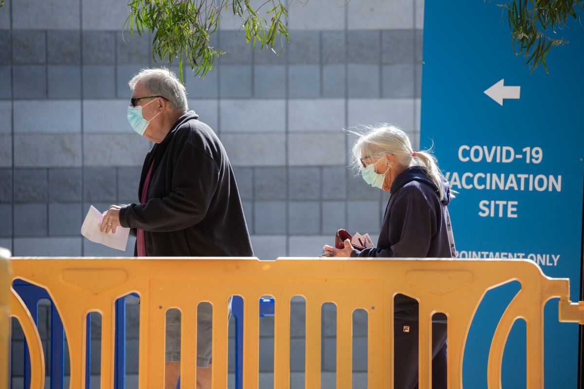 In this file photo, residents arrive at a COVID-19 vaccination site at Rimac Arena, UC San Diego.
