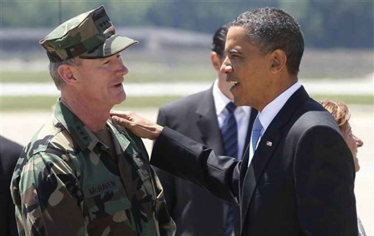 FILE - In this May 6, 2011, file photo President Barack Obama talks with U.S. Navy Vice Admiral William H. McRaven, commander of Joint Special Operations Command (JSOC), just days after McRaven led operational control of Navy SEAL Team Six's successfully mission to get Osama bin Laden, at Campbell Army Airfield in Fort Campbell, Ky. The hunt for bin Laden took nearly a decade, and it could take even longer to uncover U.S. government emails, planning reports, photographs and more that would shed light on how that elite SEAL team killed the world’s most wanted terrorist leader. (AP Photo/Charles Dharapak, File)