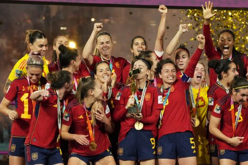 Spain's team celebrate with the trophy after the final of Women's World Cup soccer between Spain and England at Stadium Australia in Sydney, Australia, Sunday, Aug. 20, 2023. (AP Photo/Rick Rycroft)