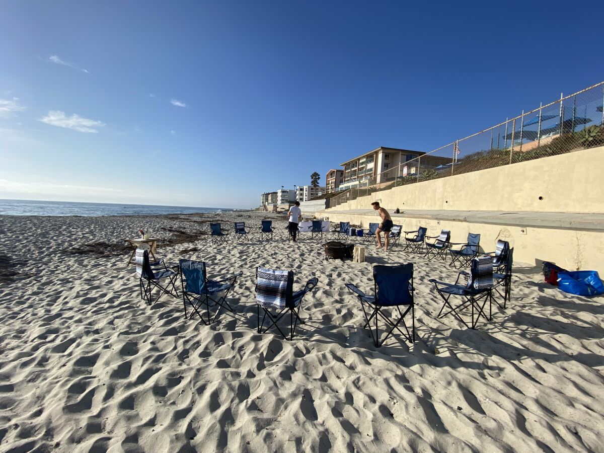 A Timeless Day sets up for a Marine Street Beach bonfire party at which alcohol would be served.