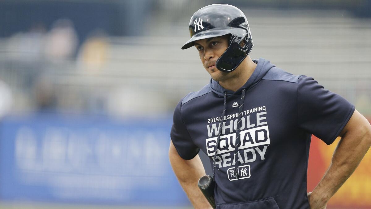 New York Yankees slugger Giancarlo Stanton looks on before a Grapefruit League spring training game against the Philadelphia Phillies on Feb. 26, 2019, in Tampa, Fla.