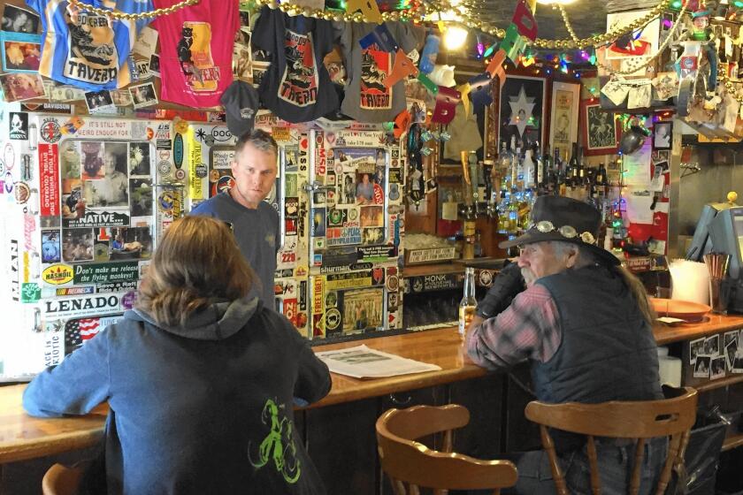 Bartender Eric Kincade talks with regulars at the Woody Creek Tavern, a longtime hangout of the writer Hunter S. Thompson.