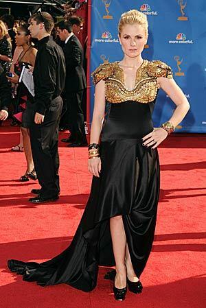 Anna Paquin's Alexander McQueen gown with armor-like detail at the shoulders and bodice is warrior chic. Her jewelry is House of Lavande.