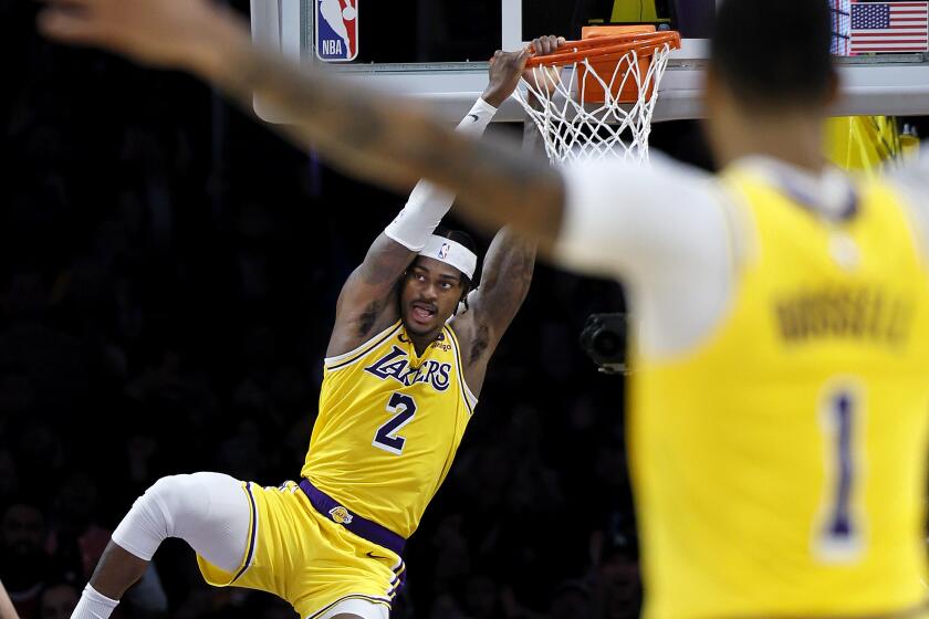 Los Angeles, CA - January 17: Lakers point guard D'Angelo Russell, #1, right, celebrates.