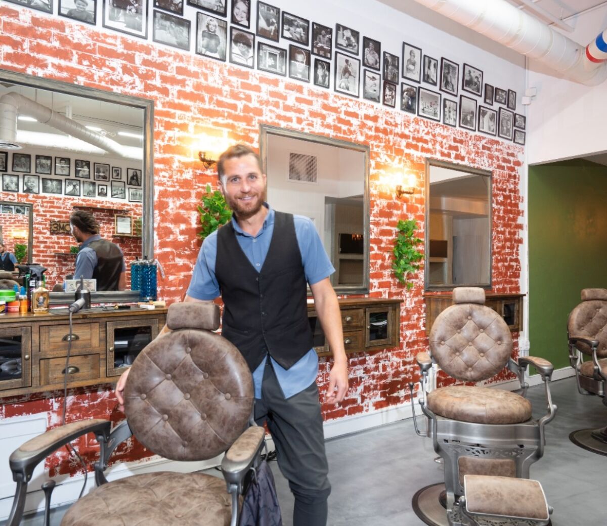 Viland "Vinny" Maldini shows his Prospect Street barbershop.