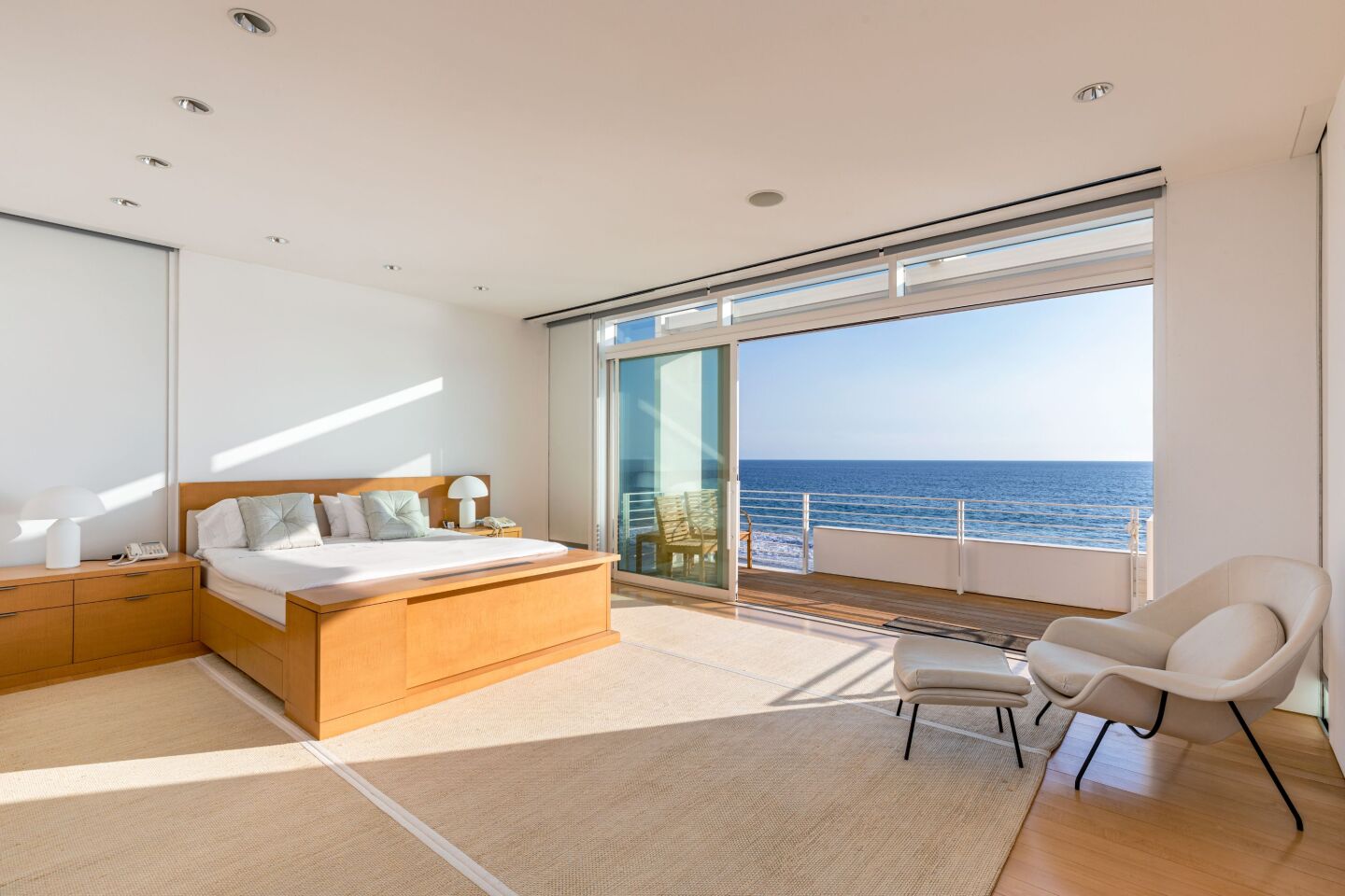 A large, airy room has a view of the ocean.