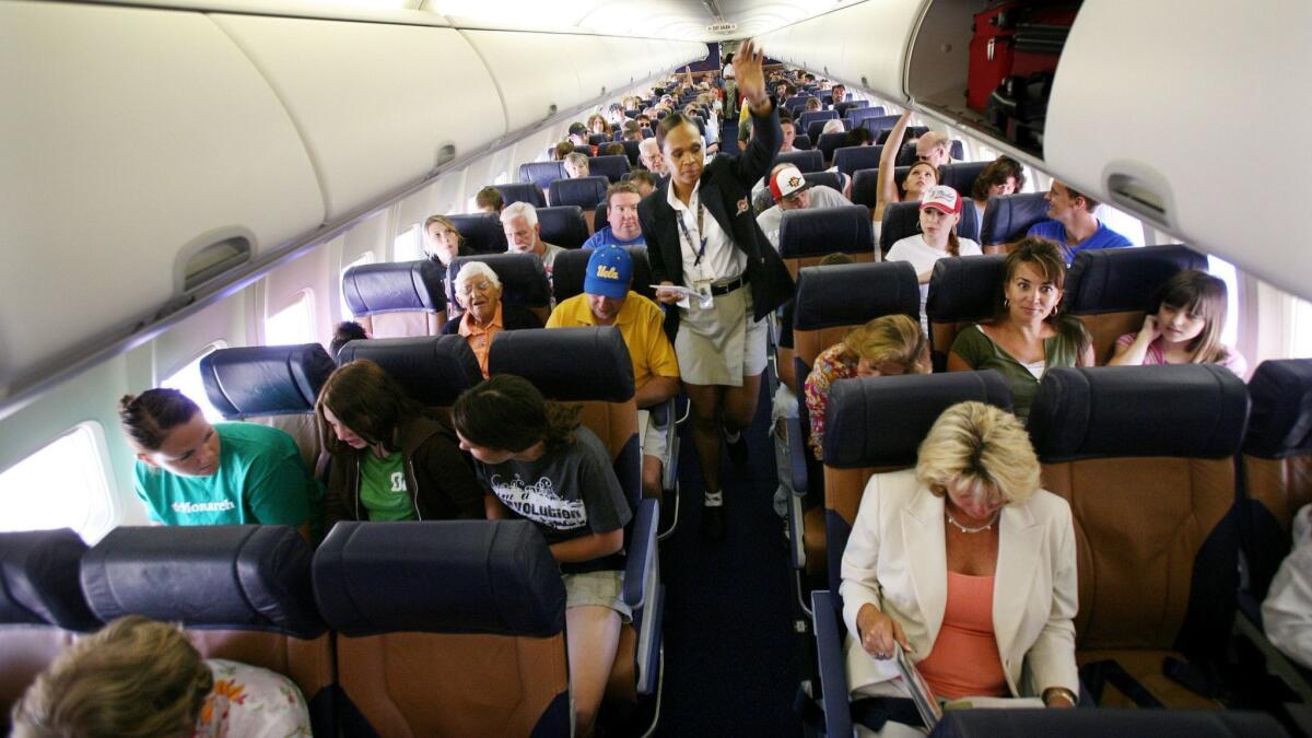 Passengers wait for their Southwest Airlines flight to take off from San Diego International Airport. The airline said it is offering free movies on all WiFi-enabled planes.