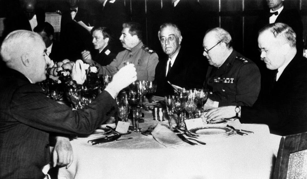Winston Churchill with other world leaders at a dinner in 1945