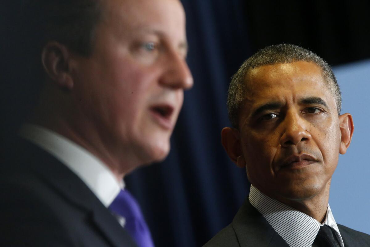 President Obama and British Prime Minister David Cameron appear at a news conference at the G7 summit in Brussels on Thursday.