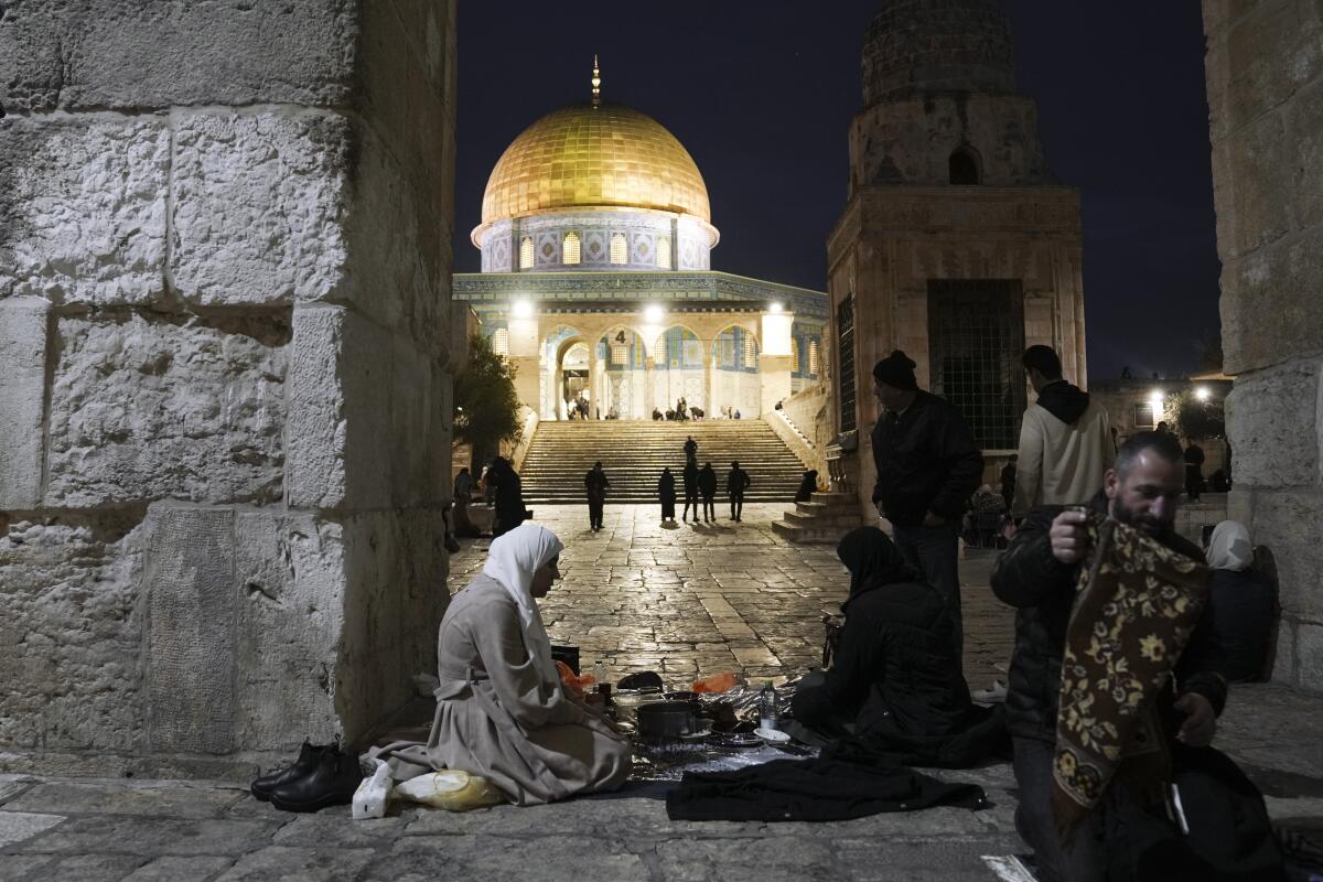Palestinian Muslims break their fast at the Al Aqsa Mosque compound in the Old City of Jerusalem