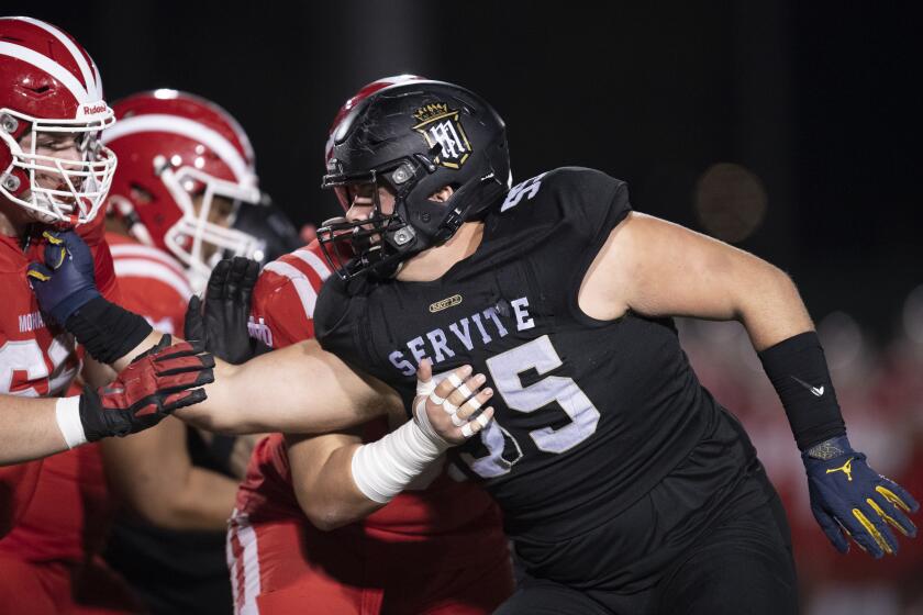 Long Beach, CA - November 26: Servite's Mason Graham (55) guards during the CIF Southern Championship 11-man football division 1 championship finals against Mater Dei in Veterans Stadium on Friday, Nov. 26, 2021 in Long Beach, CA. (Kyusung Gong / For the LA Times)