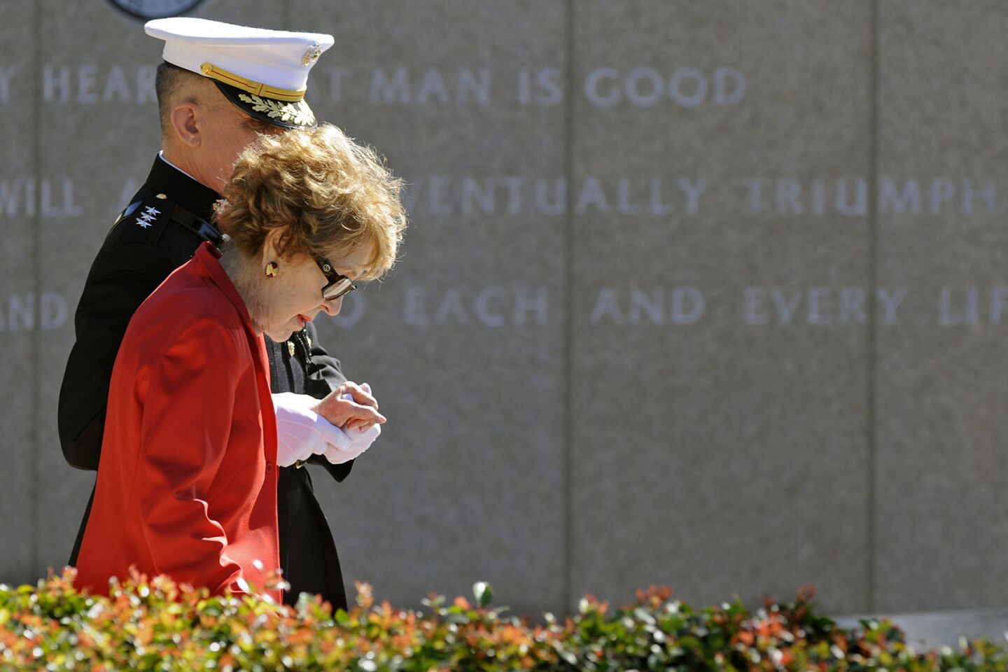 Nancy Reagan is helped by Marine Lt. Gen. George J. Flynn as she arrives for a wreath-laying ceremony at her husband's memorial at the Reagan Presidential Library in Simi Valley.