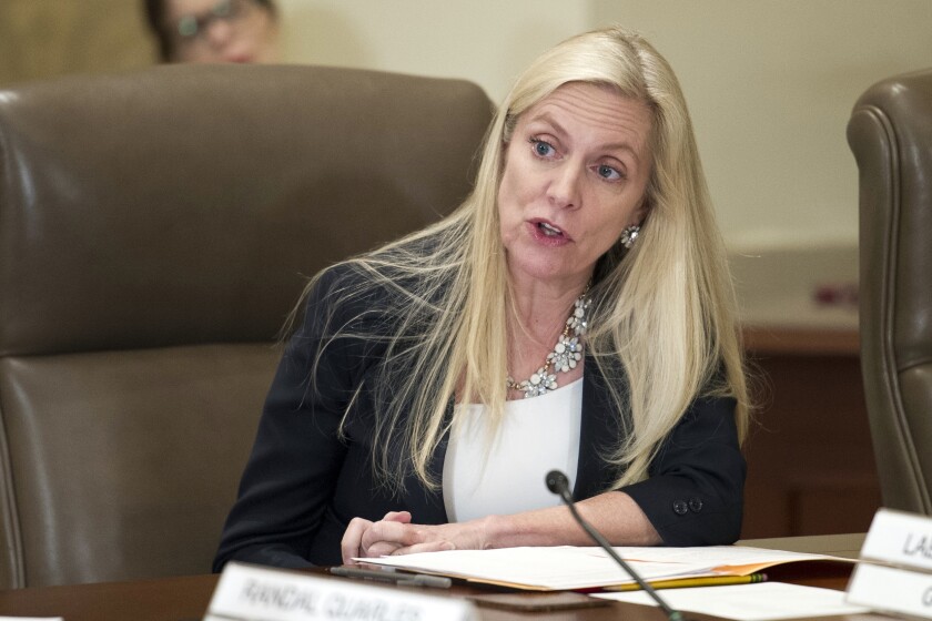 FILE - In this June 14, 2018, file photo Federal Reserve Board Governor Lael Brainard participates in an open meeting in Washington. The Federal Reserve on Thursday, May 6, 2021, is warning that the U.S. financial system remains vulnerable to threats stemming from the global pandemic. Fed board member Brainard, who chairs the central bank's financial stability committee, said in a statement that the failure of Archegos “highlights the potential for nonbank financial institutions such as hedge funds and other leveraged investors to generate large losses in the financial system.” (AP Photo/Cliff Owen, File)