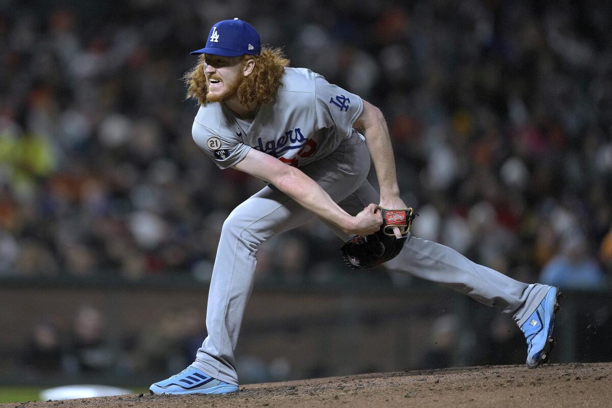 Dodgers pitcher Dustin May delivers against the San Francisco Giants on Friday night.