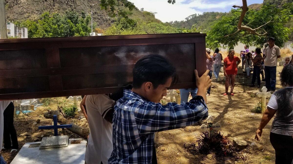 A prisoner killed in a jailhouse fire this week in Valencia, Venezuela, is buried.