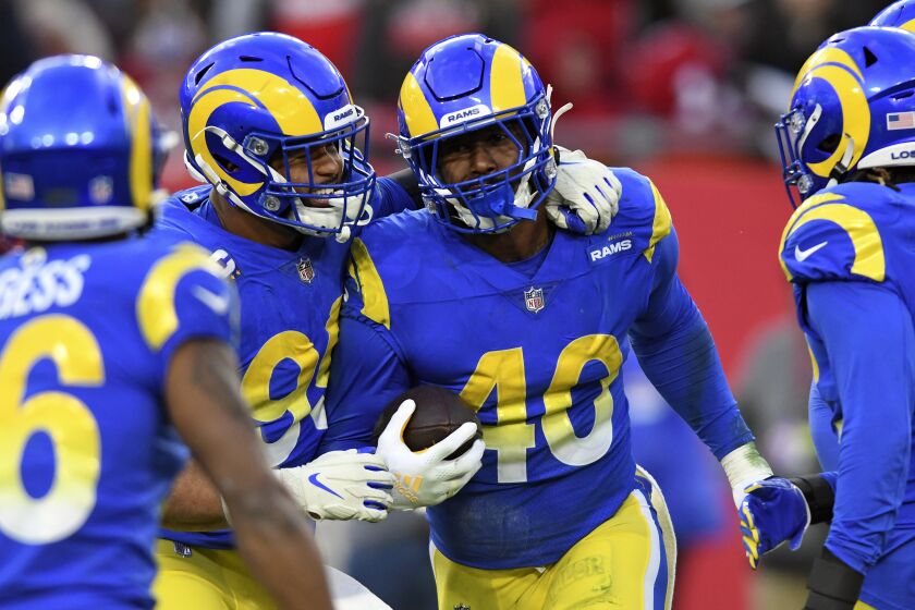 Los Angeles Rams outside linebacker Von Miller (40) celebrates with defensive end Aaron Donald.