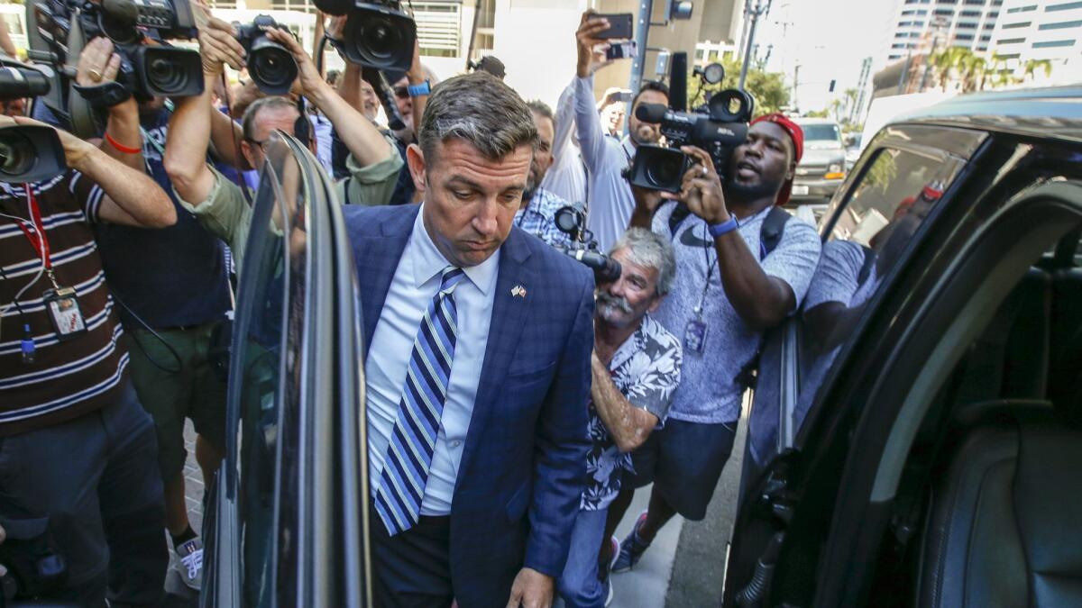 U.S. Rep. Duncan Hunter leaves a federal courthouse in San Diego after pleading not guilty to charges of illegally using his campaign account for personal expenses.