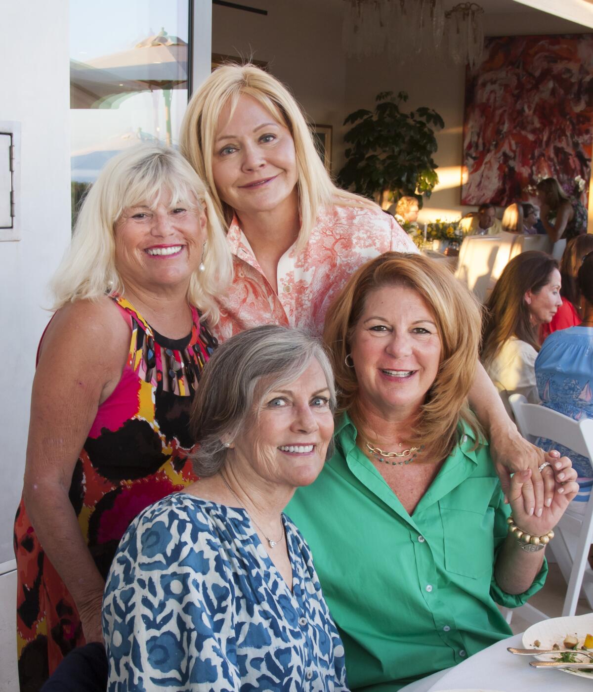 Cyndie Martin, Nancy Collins, Britt Meyer and Pam Selber, all committee members for the Roy Emerson Tennis Classic.