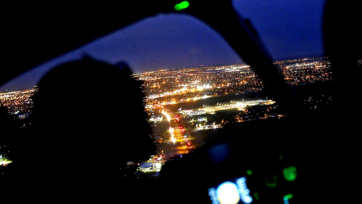 A Texas National Guard helicopter flies over Laredo on Nov. 13. Gov. Rick Perry sent the guard to the border to reinforce the U.S. Border Patrol.