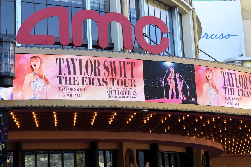 The AMC The Grove theatre marquee is pictured ahead of the "Taylor Swift: The Eras Tour" concert movie world premiere in Los Angeles, California on October 11, 2023. (Photo by VALERIE MACON / AFP) (Photo by VALERIE MACON/AFP via Getty Images)