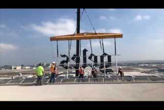 Los Angeles Times sign goes up on new building