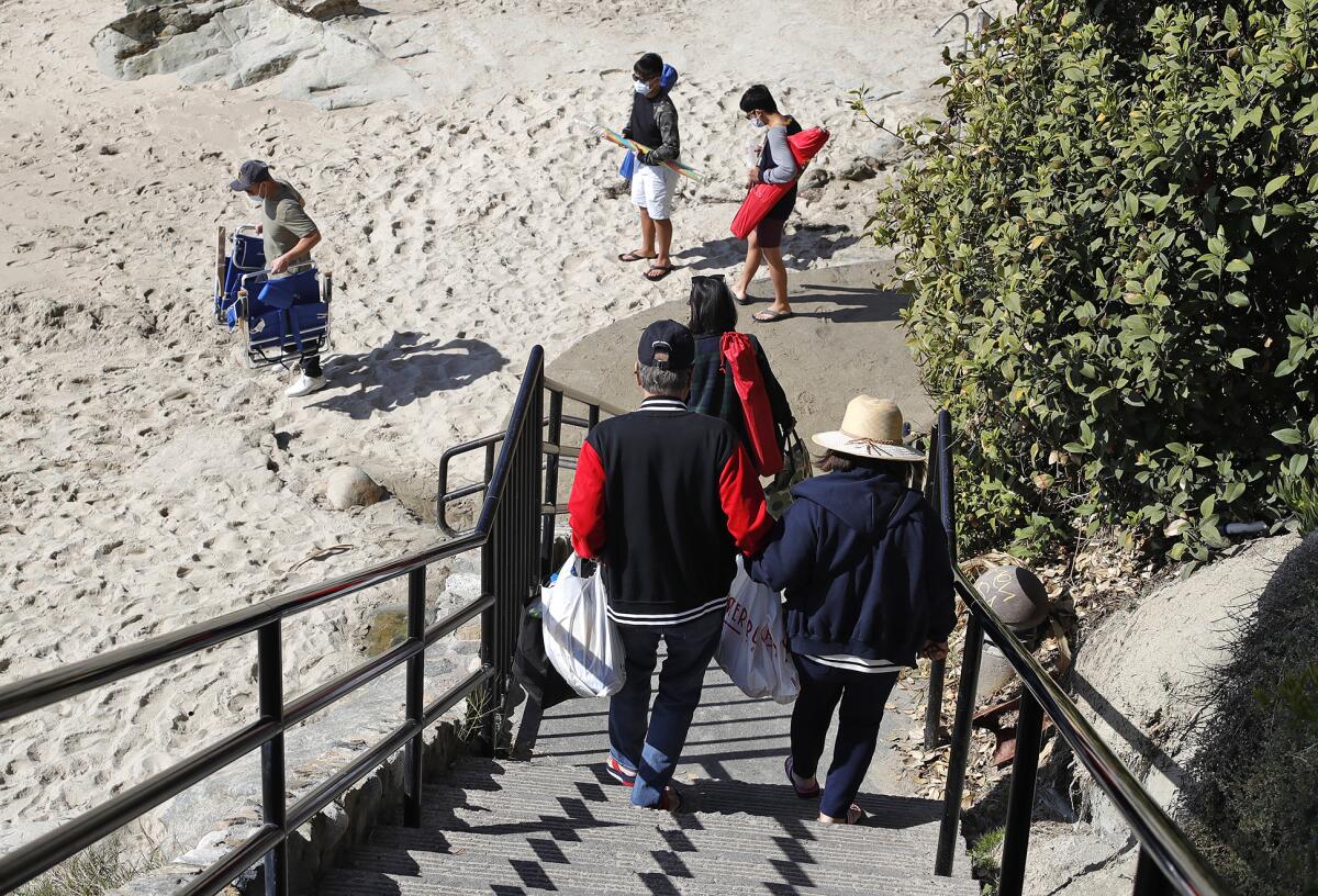 Visitors arrive to Rockpile Beach in Laguna on Wednesday, April 21.