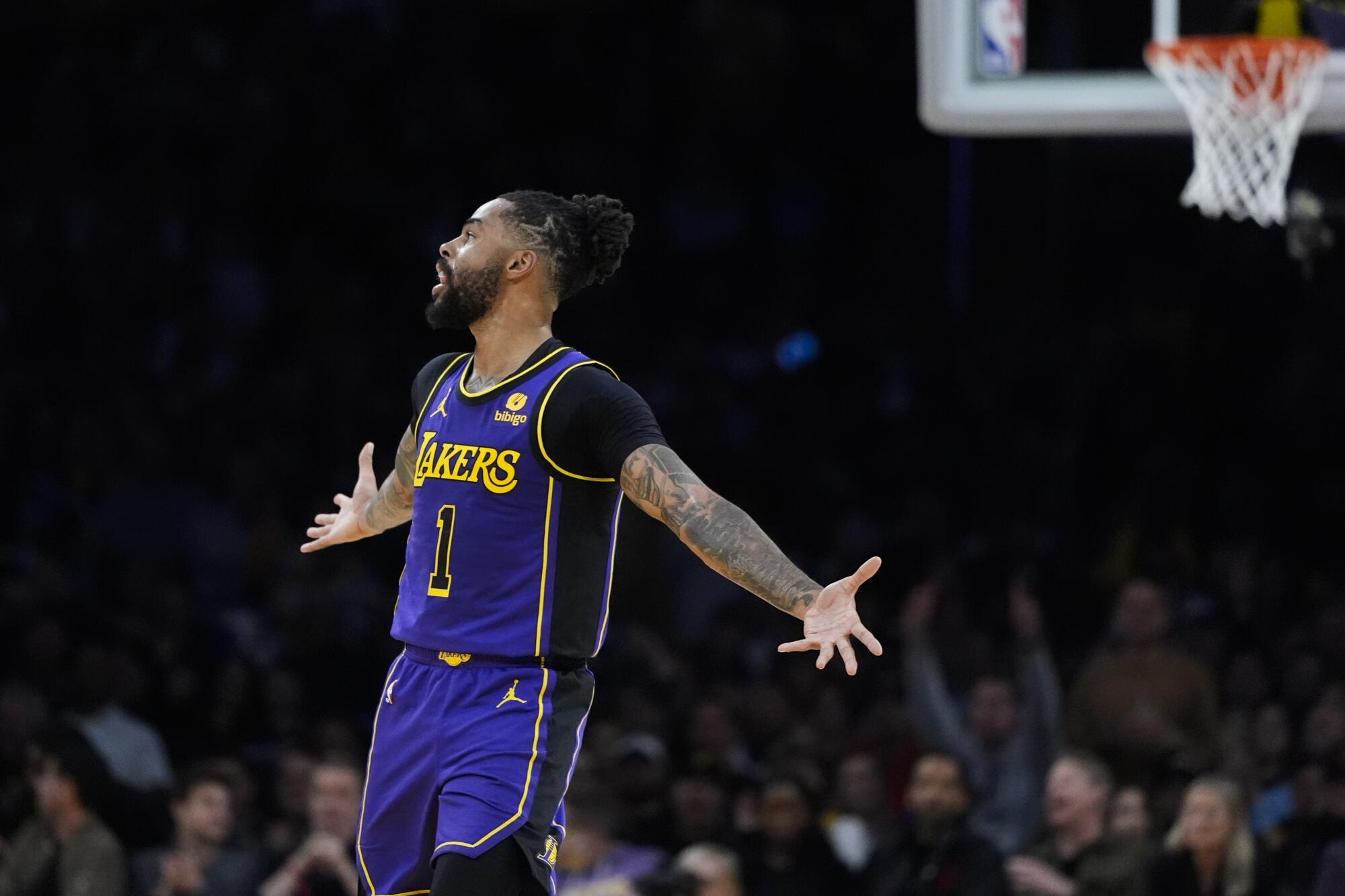 Lakers guard D'Angelo Russell celebrates after making a three-point shot against the Bucks on Friday night.