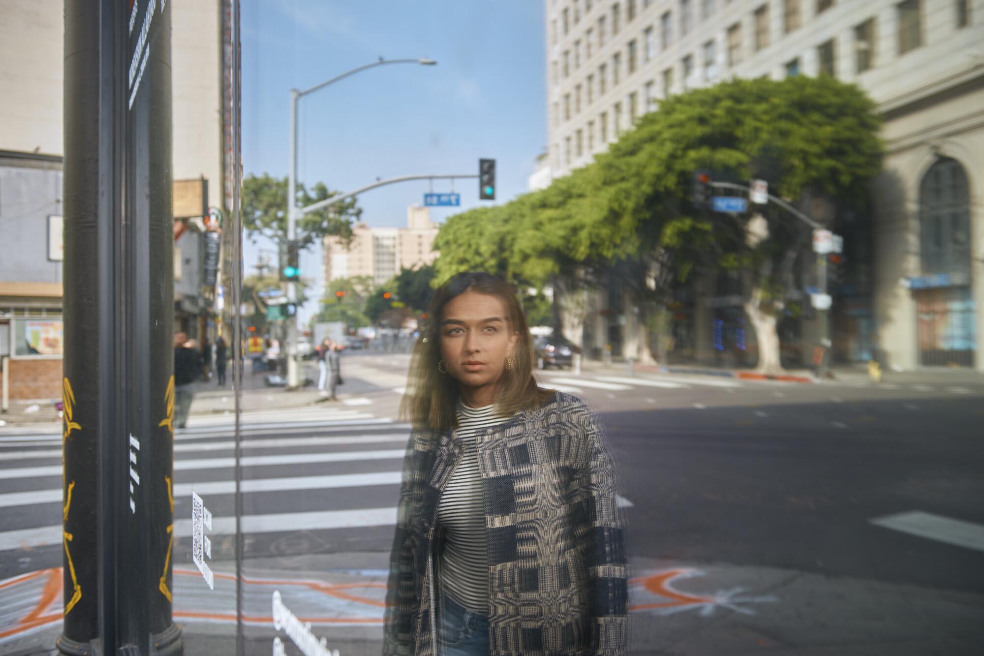 Zehra Ahmed, curator of Womxn in Windows, photographed outside the building of the exhibition in Downtown L.A.