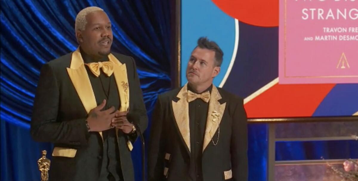 Travon Free and Martin Desmond Roe, in matching tuxes, speak at the Oscars.