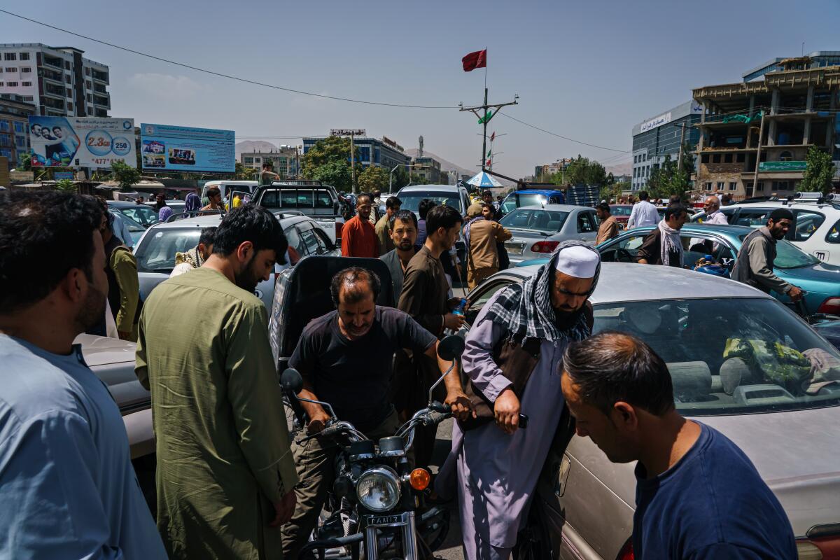 Pedestrians and motorists got stuck in traffic amid rumors of a transfer of power on Sunday in Kabul, Afghanistan.