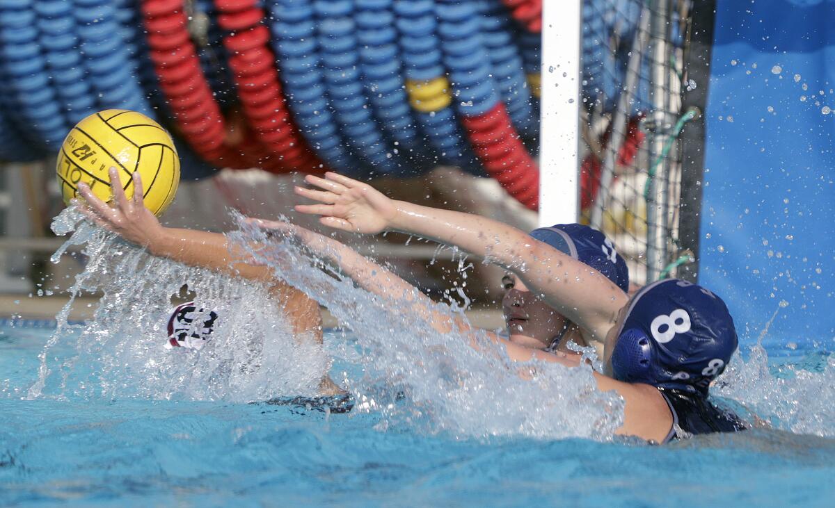 Flintridge Prep's Emily Battaglia and Natalie Kaplanyan defend in the CIF Southern Section Division VI semifinal girls' water polo playoff at Polytechnic School in Pasadena on Wednesday, February 19, 2020.