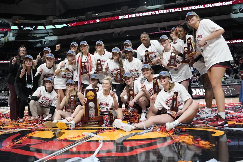 Transylvania players celebrate after winning the NCAA Women's Division 3 championship basketball game against Christopher Newport Saturday, April 1, 2023, in Dallas.(AP Photo/Darron Cummings)