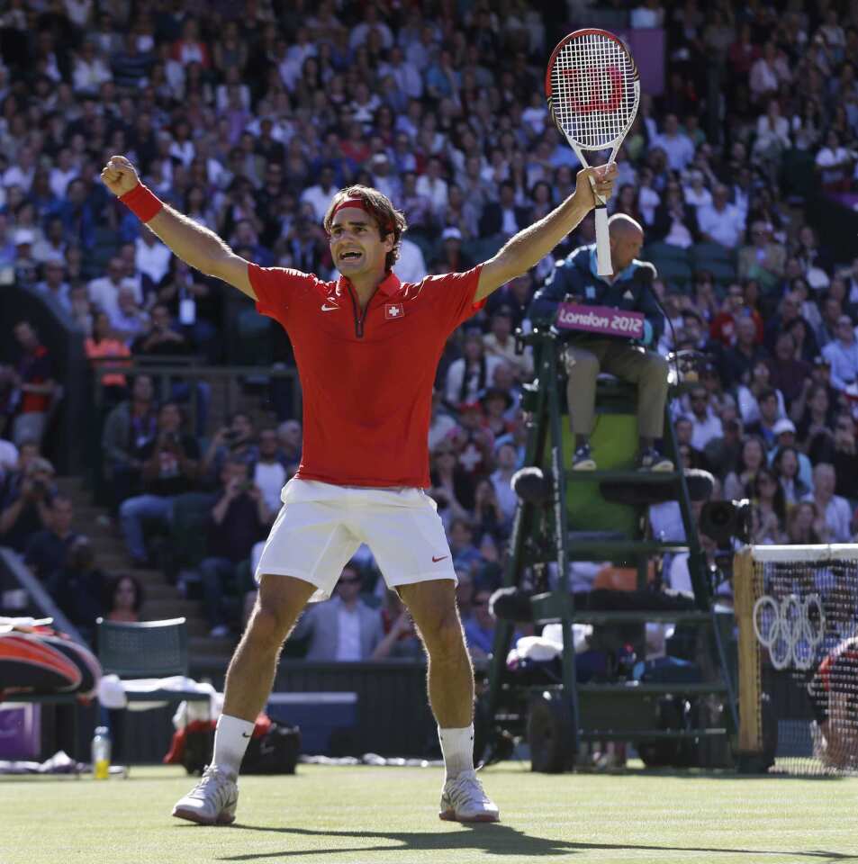 Roger Federer of Switzerland celebrates his victory over Juan Martin del Potro of Argentina in the semifinals of the London Olympics men's singles tennis tournament. Federer won the match, 3-6, 7-6, 19-17. It was the longest match in Olympic history.