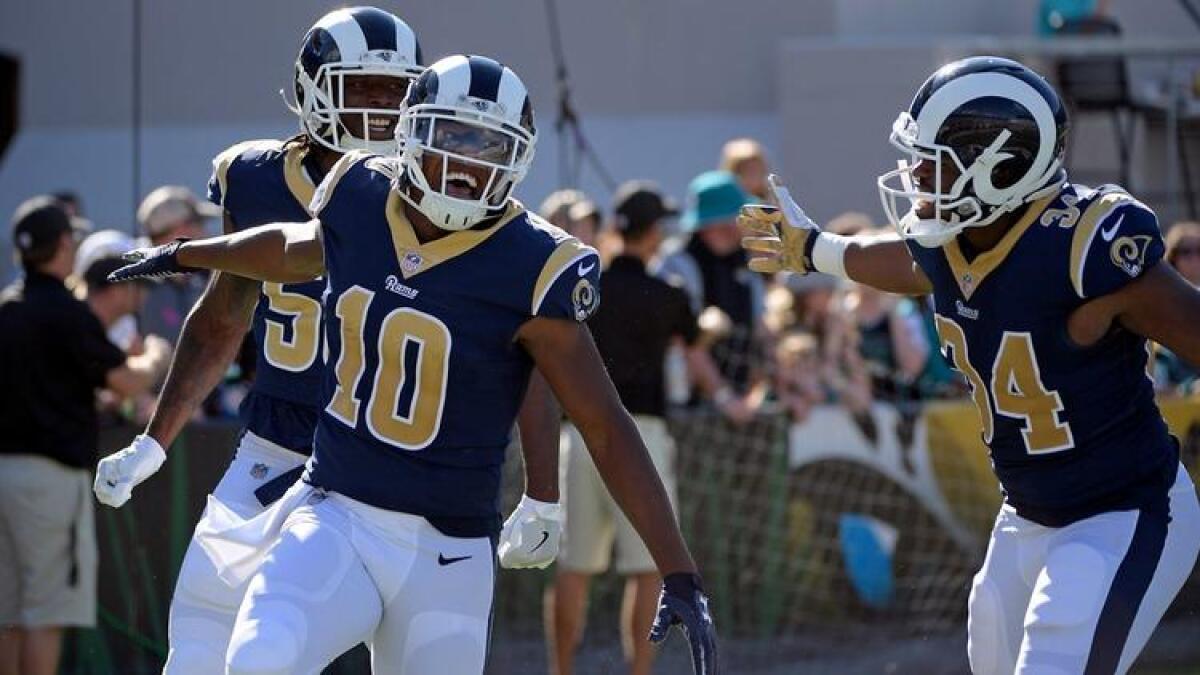 Rams' Pharoh Cooper (10) celebrates a 103-yard touchdown kickoff return against the Jacksonville Jaguars during the first half Sunday.
