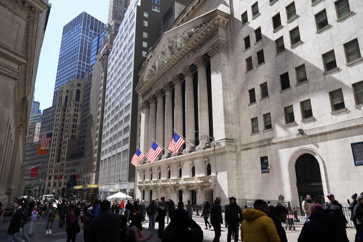 Stock market today: Wall Street gains ground after surprisingly strong U.S. jobs report