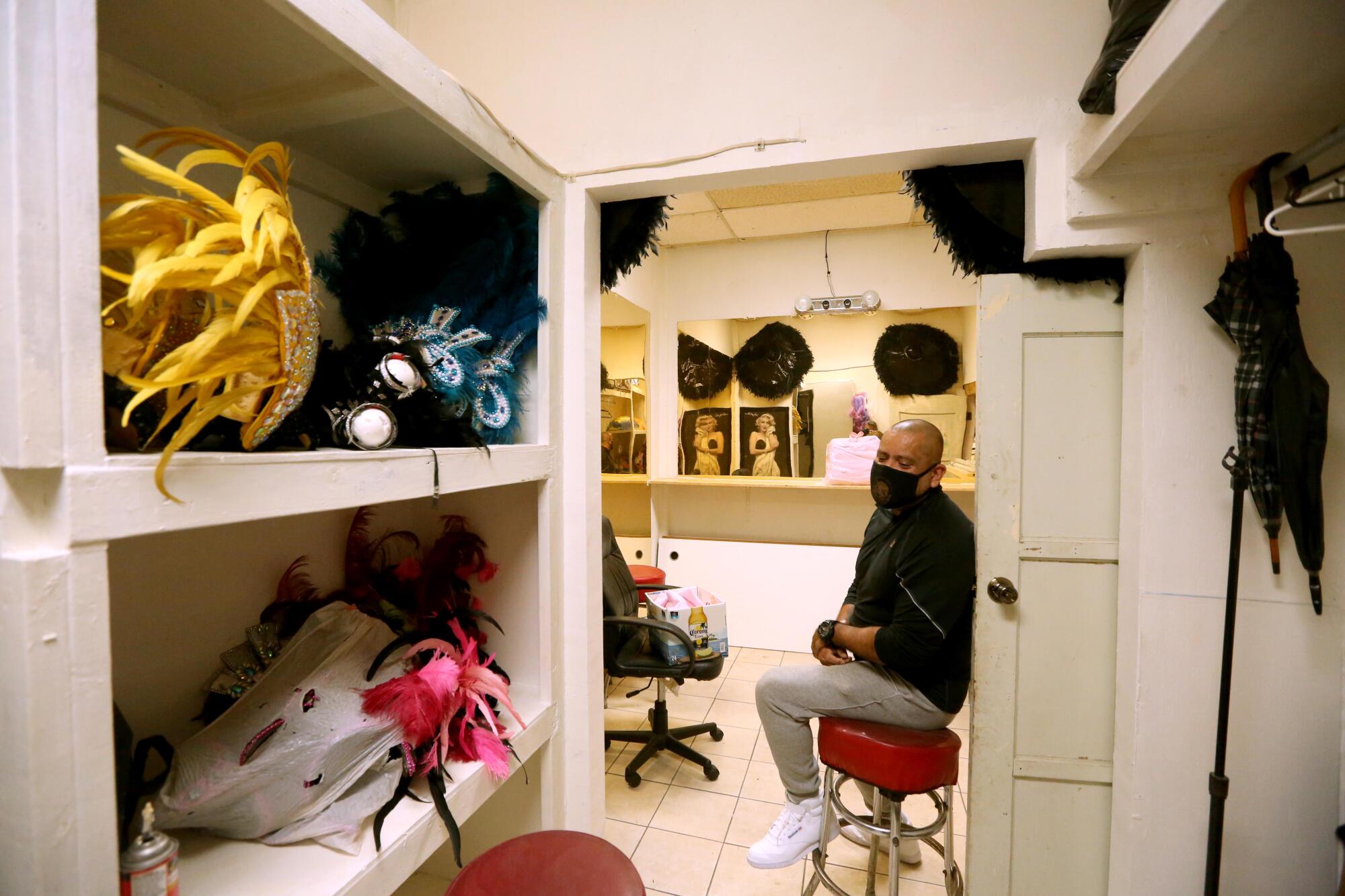 Sergio Hernandez sits in a dressing room.