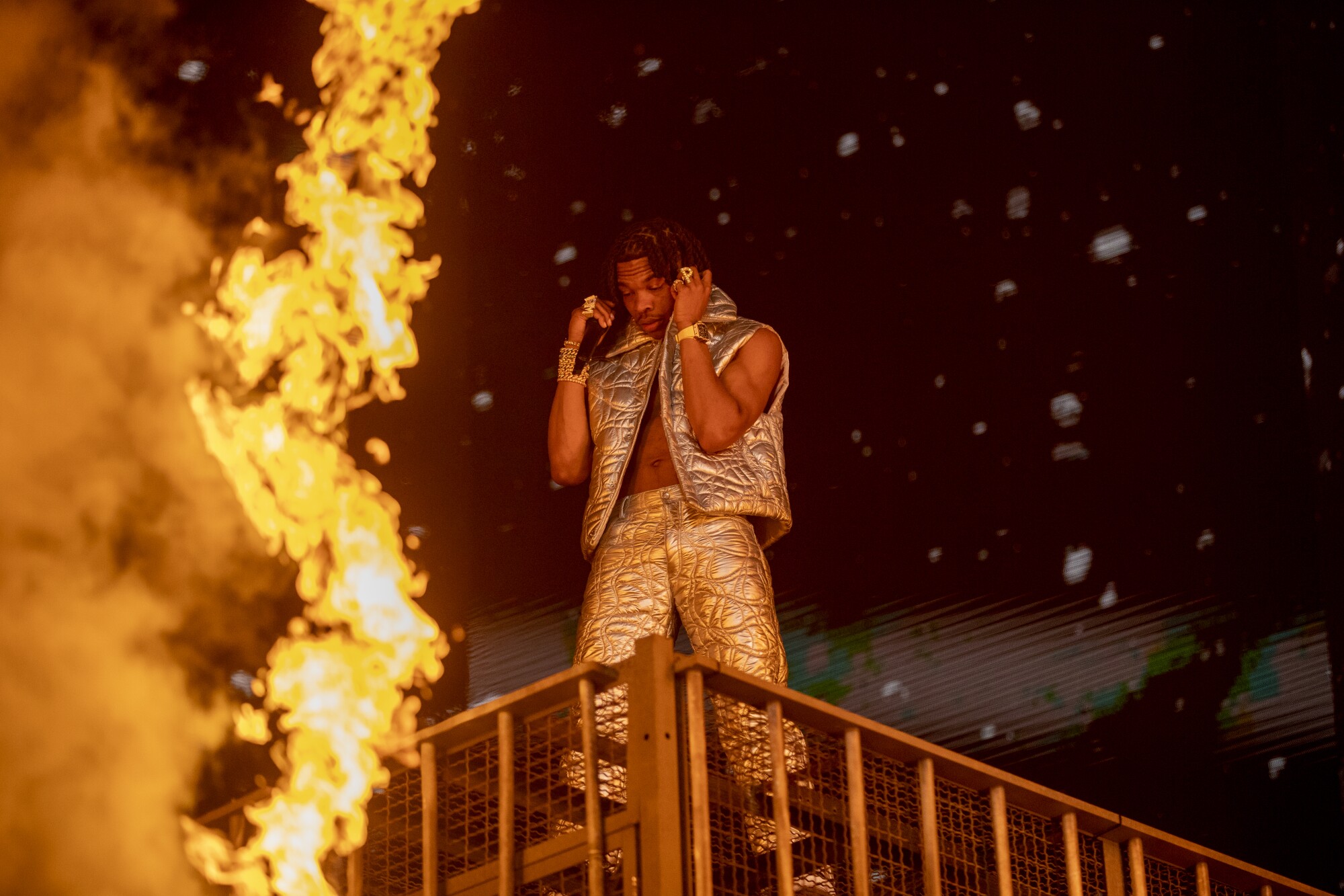 Lil Baby comes close to fire effects while performing at the Coachella festival.