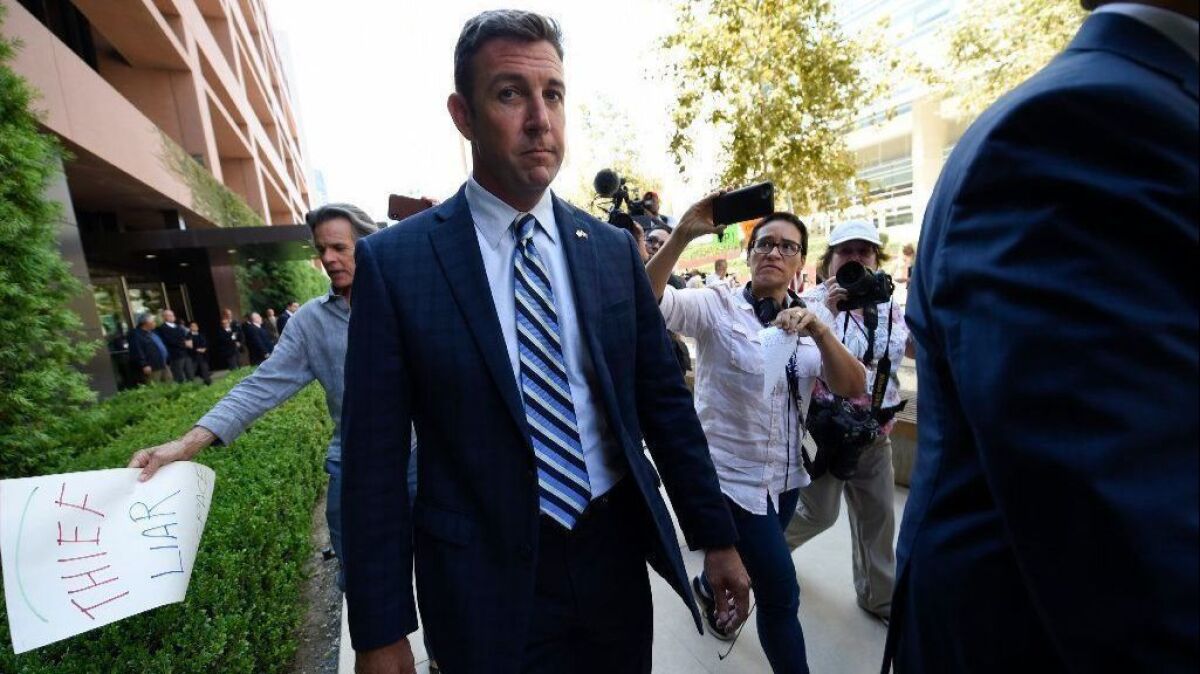 Rep. Duncan Hunter leaves an arraignment hearing in San Diego on Aug. 23.