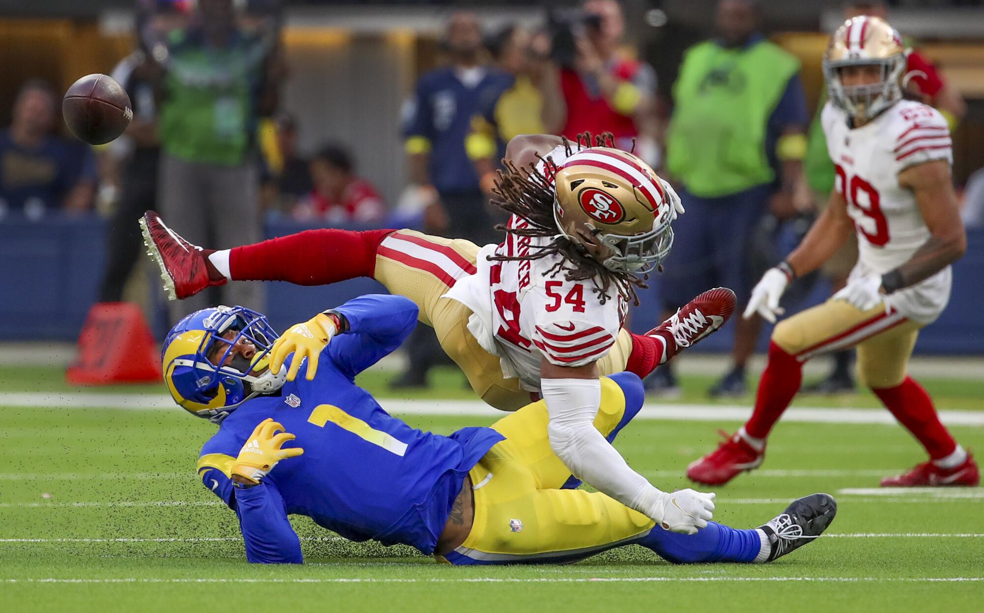 Rams wide receiver Allen Robinson watches a pass deflected by San Francisco 49ers linebacker Fred Warner.
