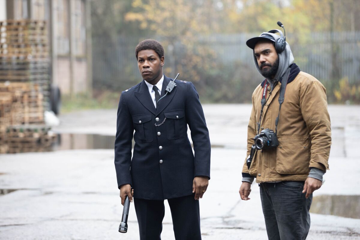 John Boyega as Leroy Logan, left, and director of photography Shabier Kirchner on the set of "Red, White and Blue."