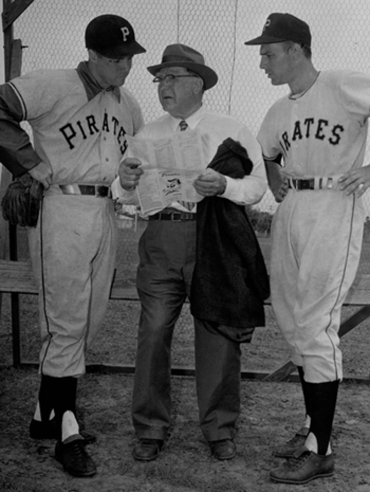 Branch Rickey, 75-year-old chairman of the board of directors of the Pittsburgh Pirates, as he talks to two Pirates' players, pitcher Bob Friend, left, and infielder Dick Groat in 1957. Rickey had one of the keenest minds in baseball. He is the father of the game's farm system.