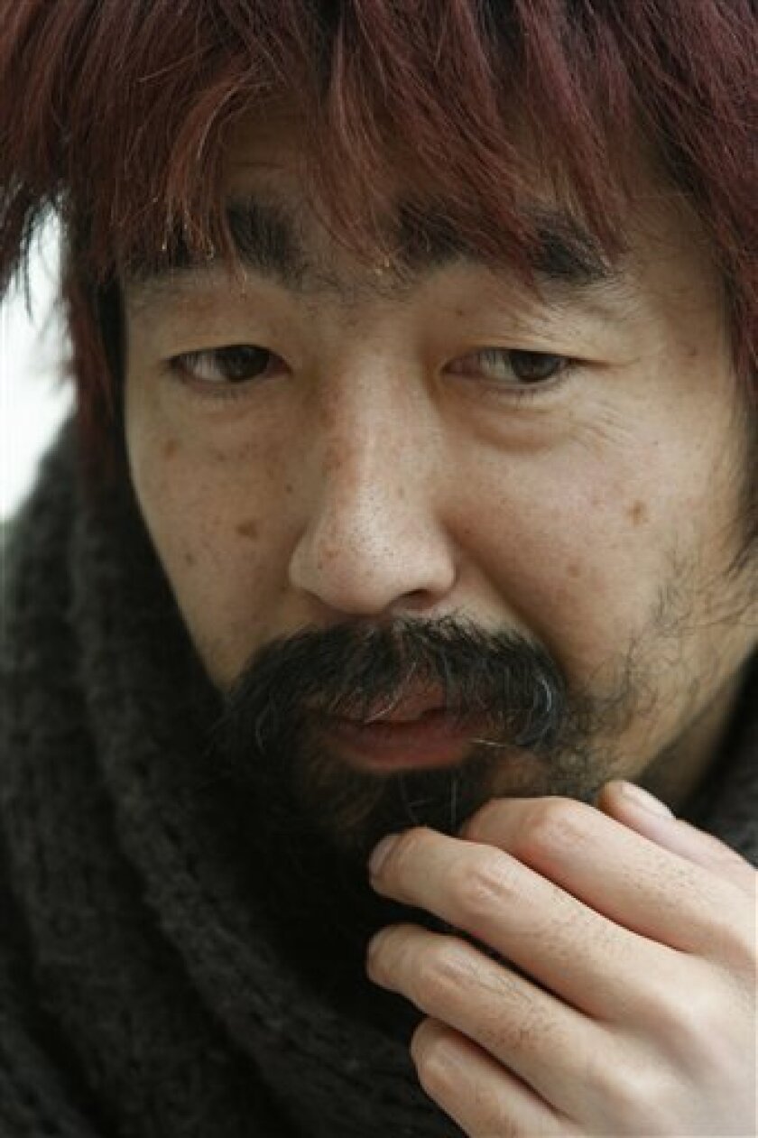 Hiroshi Nohara is seen in Benito Juarez International airport in Mexico City, Thursday, Nov. 20, 2008. For reasons he cannot explain, Nohara, a Japanese citizen, has been in Terminal 1 of the airport since Sept. 2, surviving off donations from fast-food restaurants and sleeping in a chair. (AP Photo/Marco Ugarte)