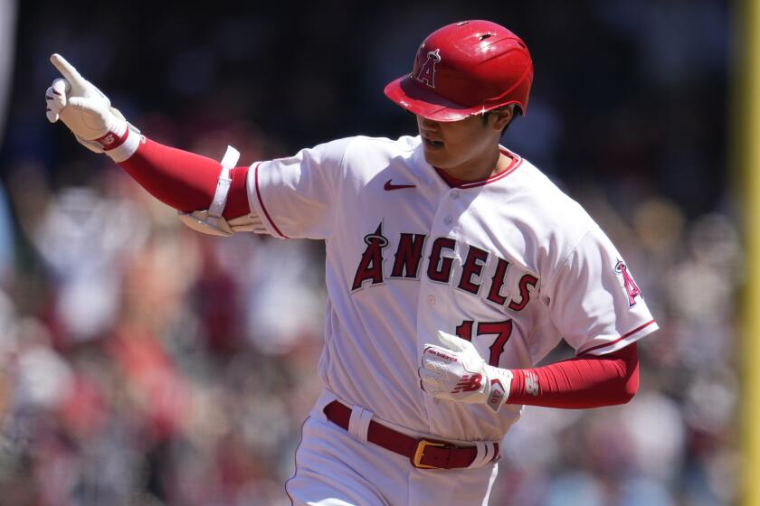 Los Angeles Angels' Shohei Ohtani celebrates has rounds the bases after his two-run home run.