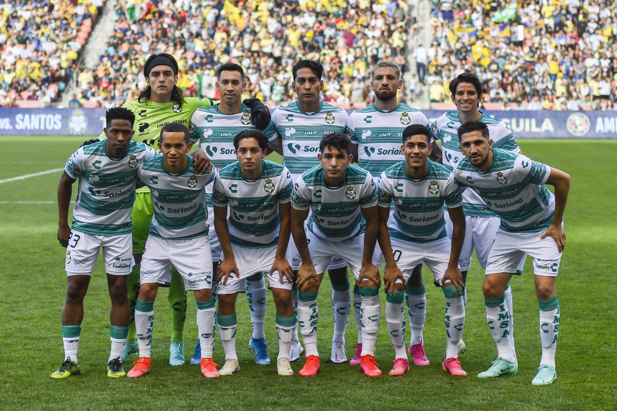 Members of Santos Laguna pose for a photo 