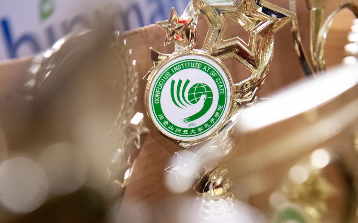 A box of trophies sit in a storage box in an empty Confucius Institute classroom at San Francisco State.