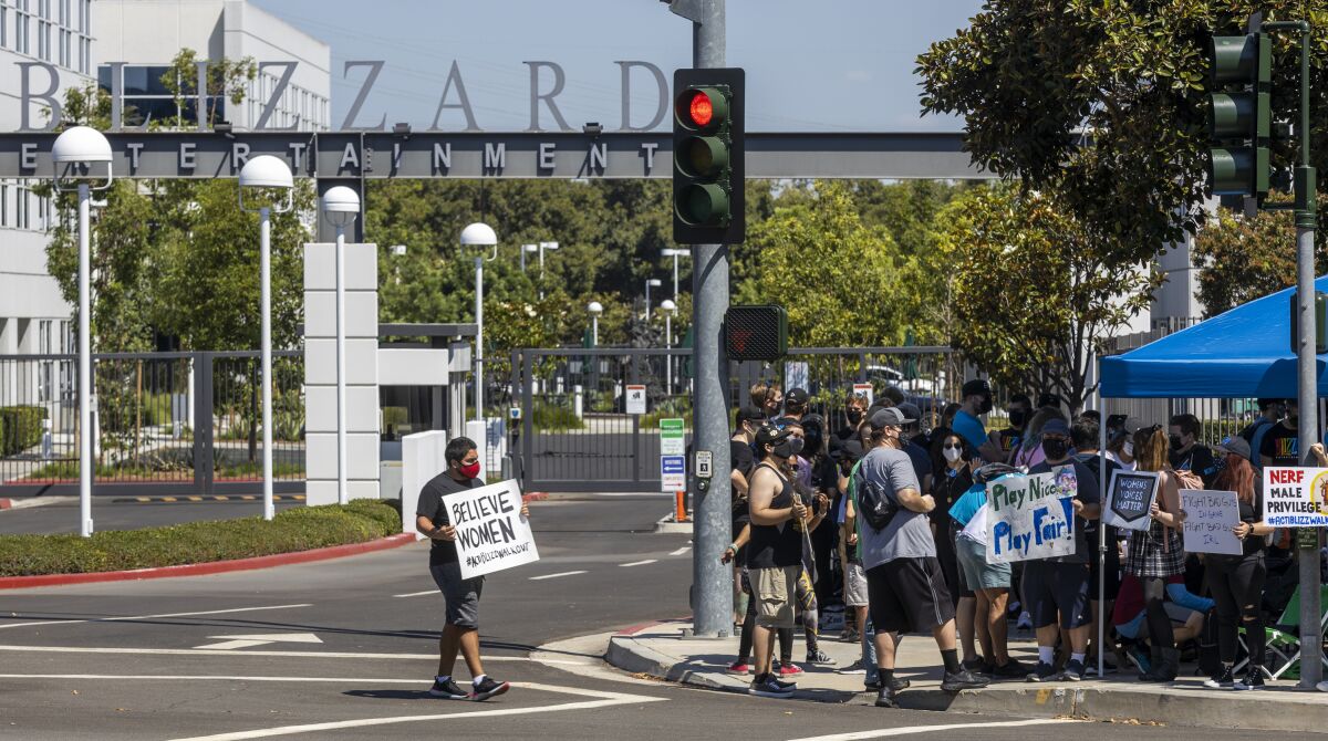 Several hundred Activision Blizzard employees stage a walkout outside the company's Irvine office
