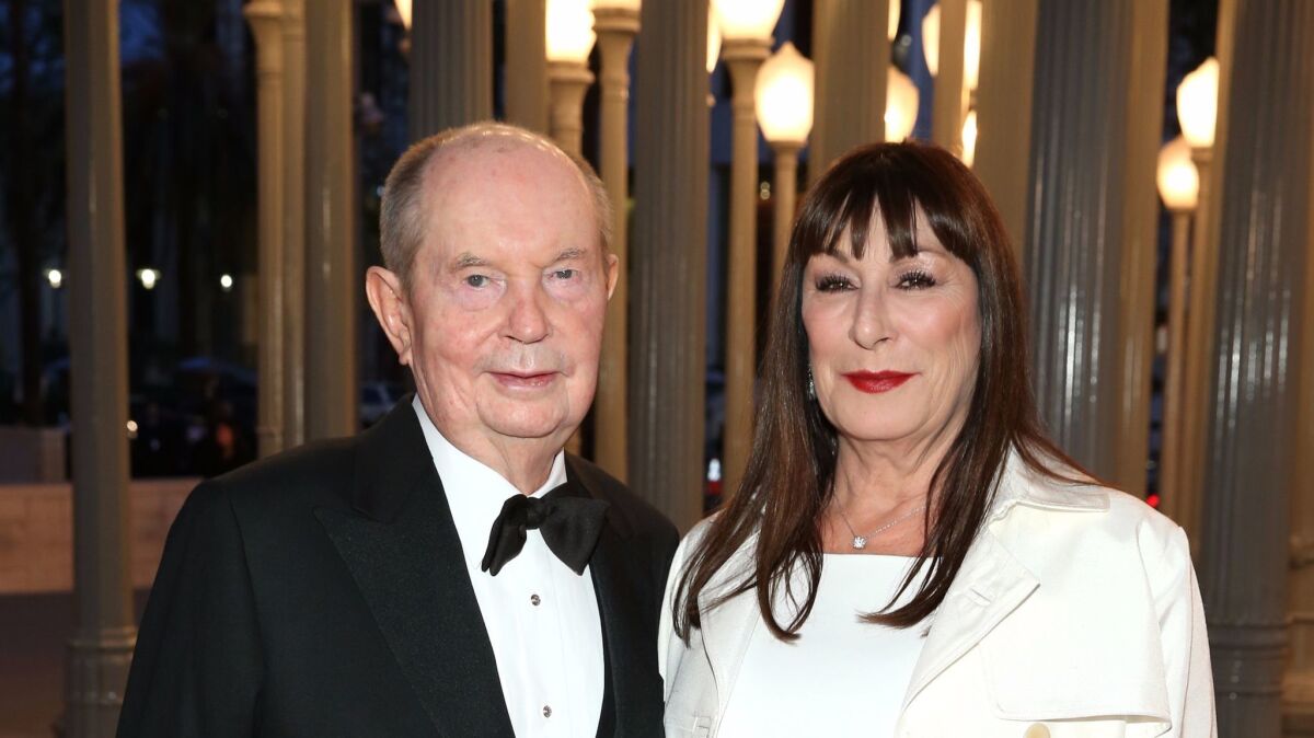 Jerry Perenchio (L) and actress Anjelica Huston attend the LACMA 50th Anniversary Gala in 2015.
